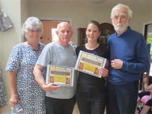 Picture of group holding Linda McEnhill award 