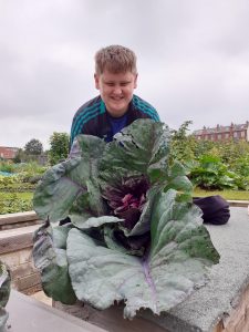 A man holding a cauliflower.