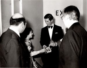 A black and white photograph of a young Katy with King Charles