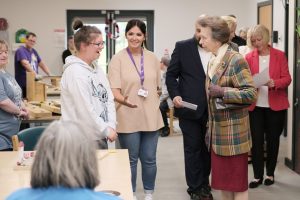 The Princess Royal talking to two women