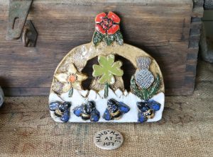 The pottery crown decorated with the national flowers of each of the four UK nations