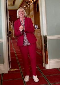 Mandy Bunce in a red pantsuit