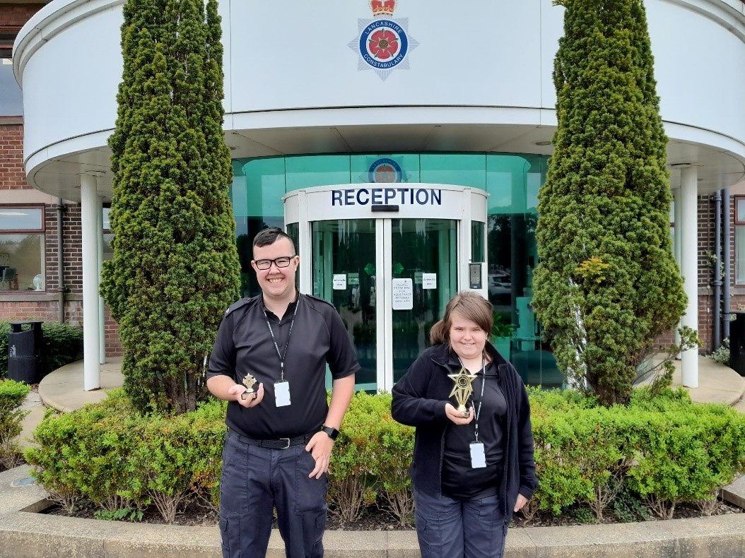 Two of the winners from the Lancashire Constabulary with their trophies.