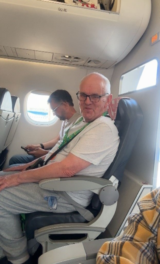 Richard on the plane to Paris.