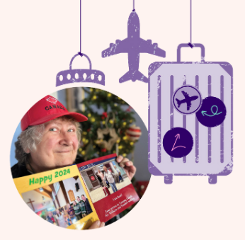 Jane holding her Christmas 2024 photo book. She's wearing a red Canada hat and there's a Christmas tree in the background.